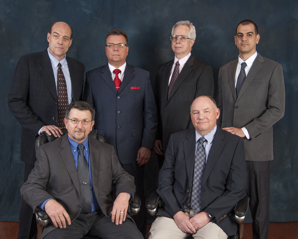 Group picture of PFN Exectutives. Left to right: (Top) J. Thomas Sumbler, James P. Brogan, David S McCartney, M. Koray Inal (Bottom) William C. Tidd, Paul W. Stark Proehl, and James F. Bednarek